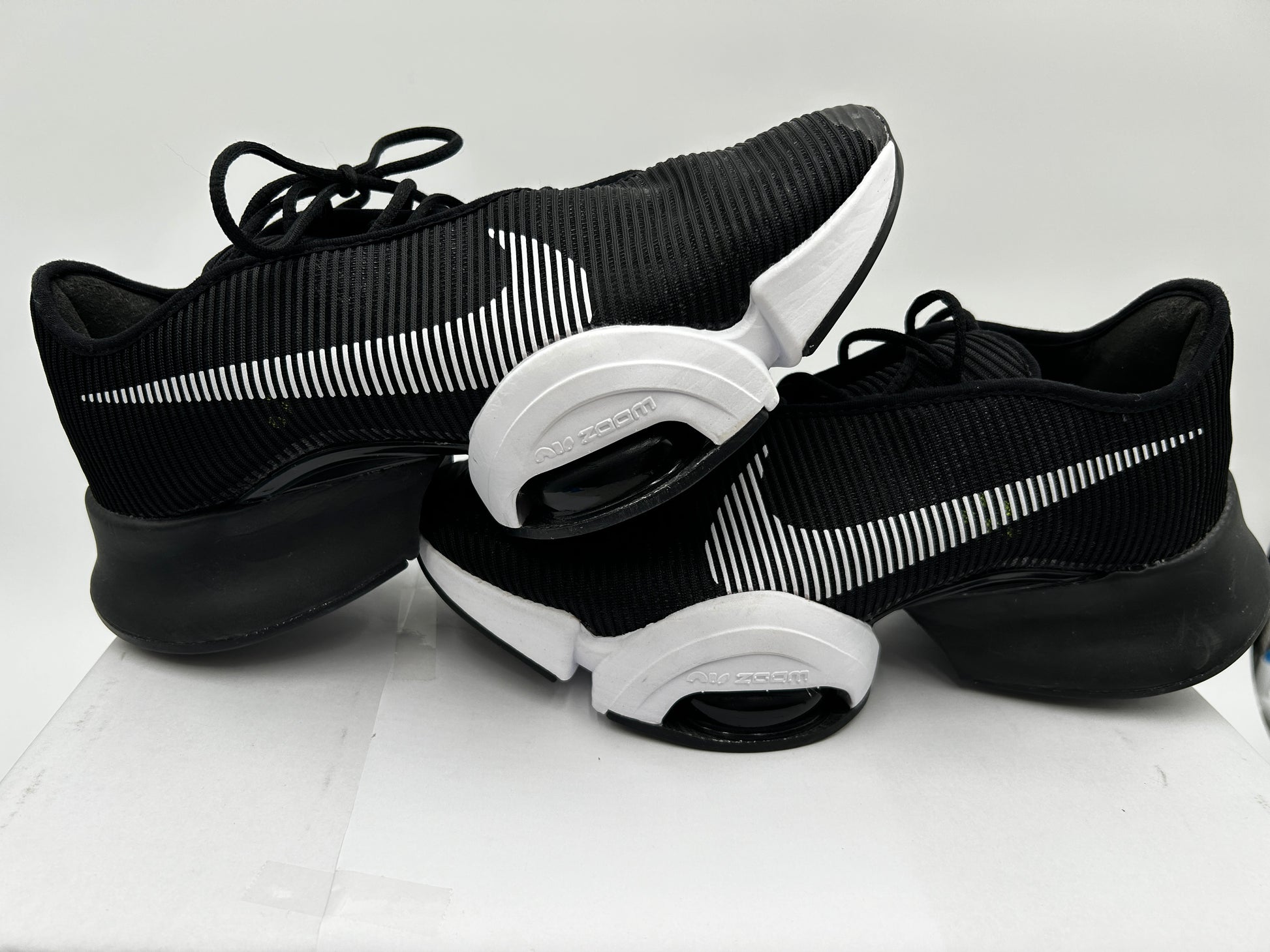 Black and white sneakers on a light gray background