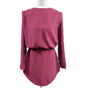 Pink long-sleeve top on a mannequin against a white background