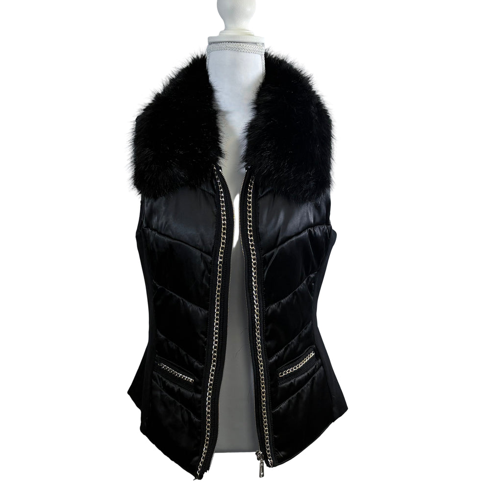 Black puffer vest with fur collar on a mannequin against a white background
