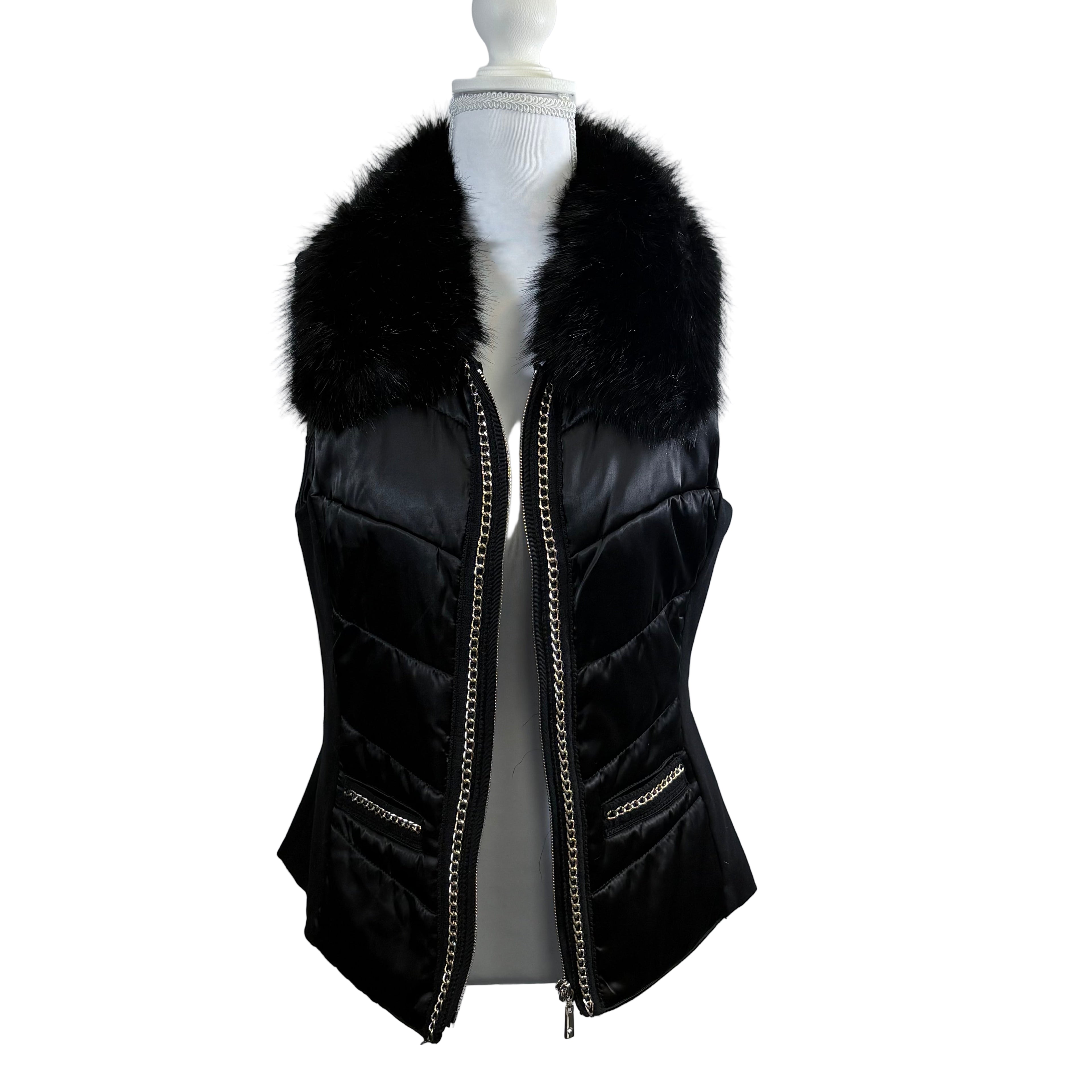 Black puffer vest with fur collar on a mannequin against a white background