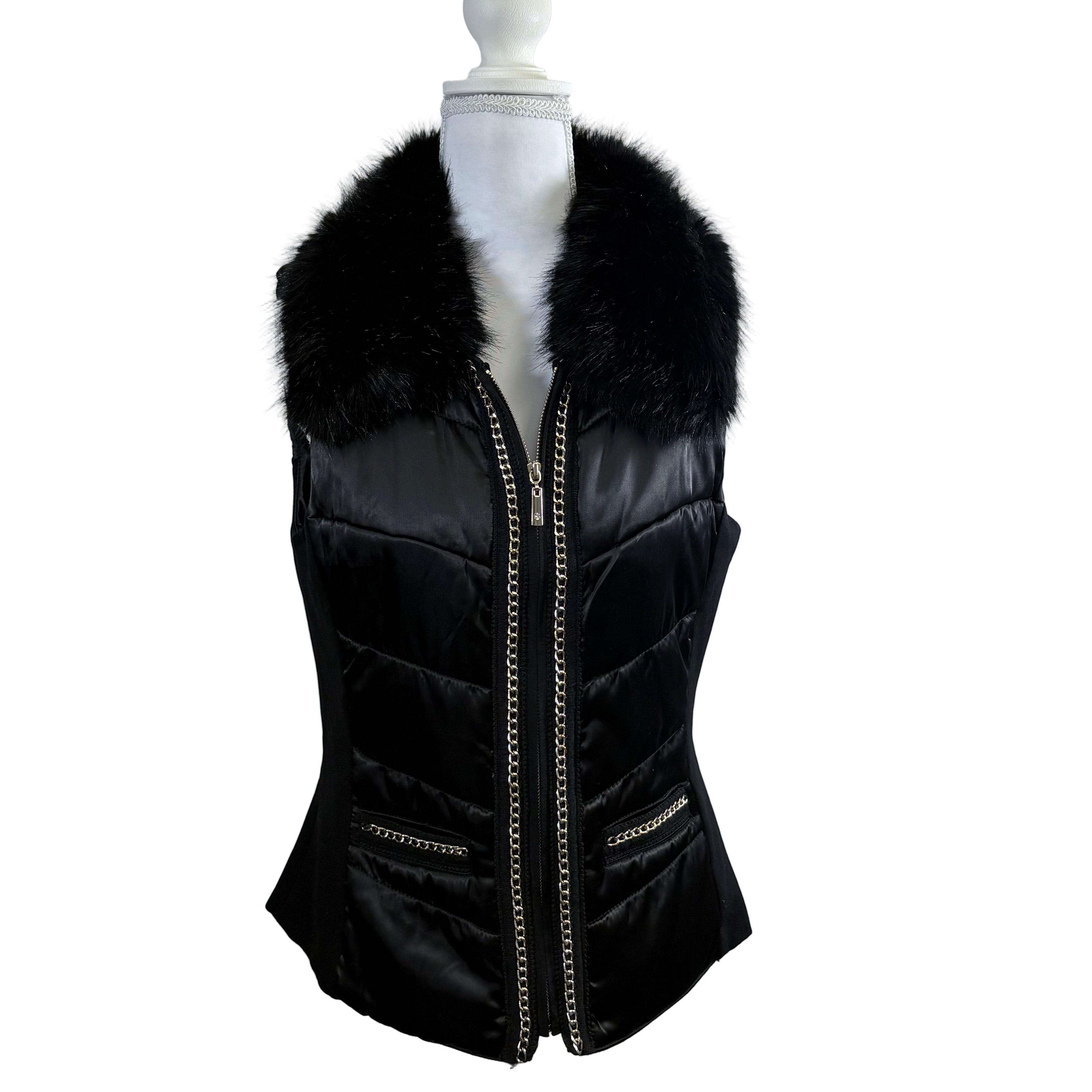 Black puffer vest with fur collar on a mannequin against a white background