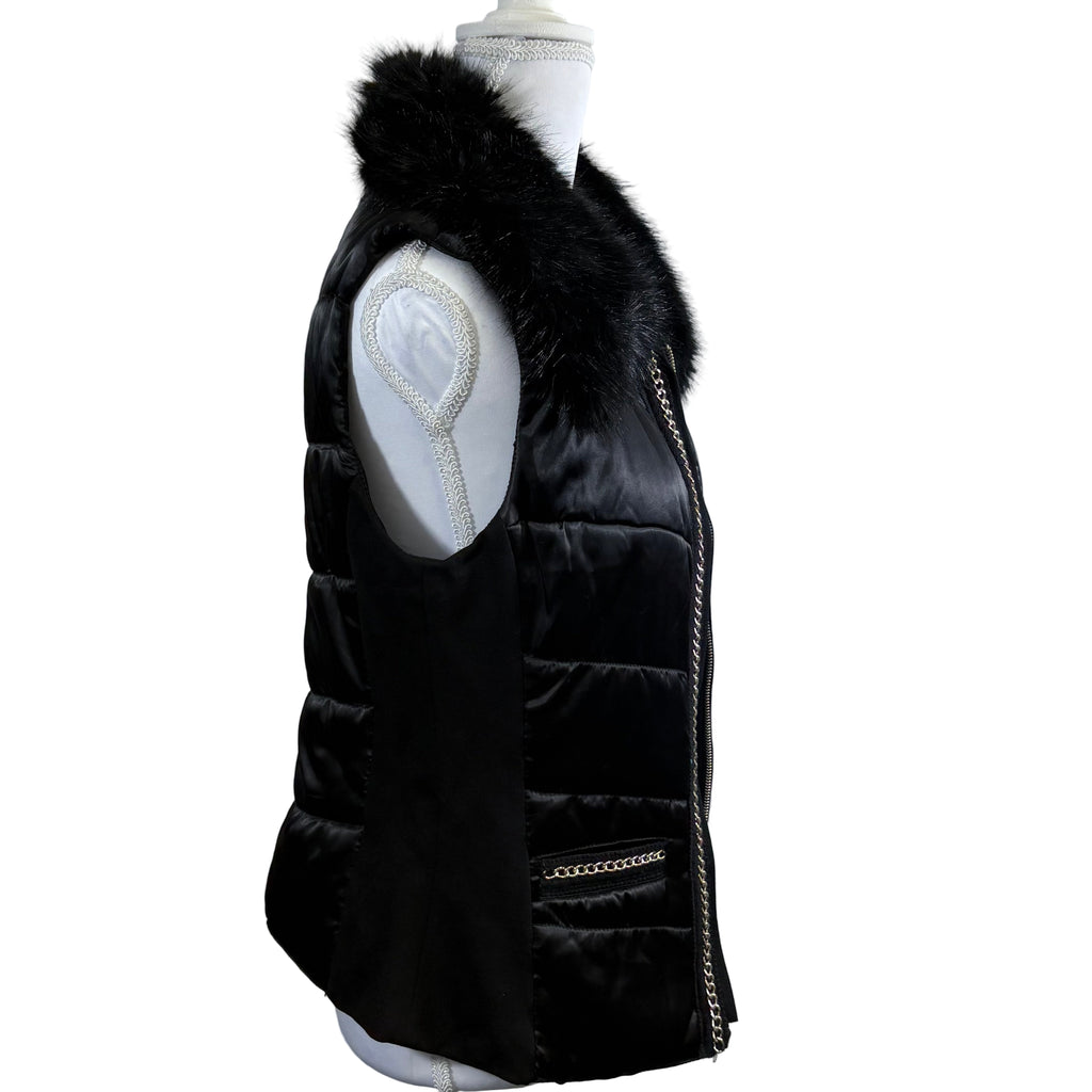 Black puffer vest with fur hood on a mannequin against a white background