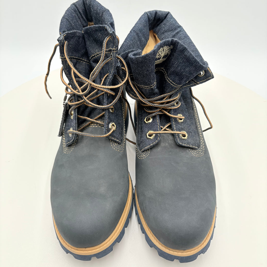 Pair of blue Timberland boots on a white background