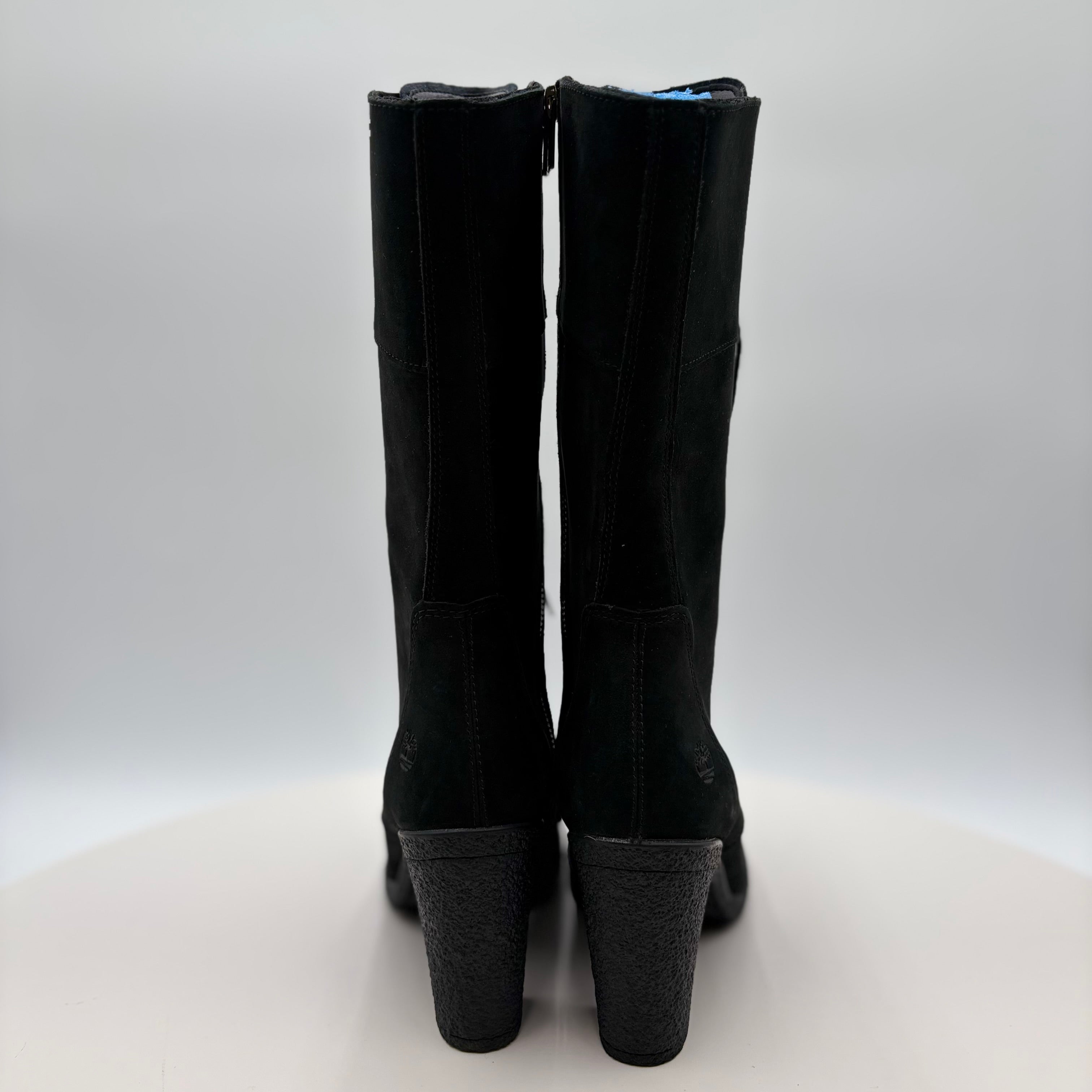 Black knee-high boots on a white background