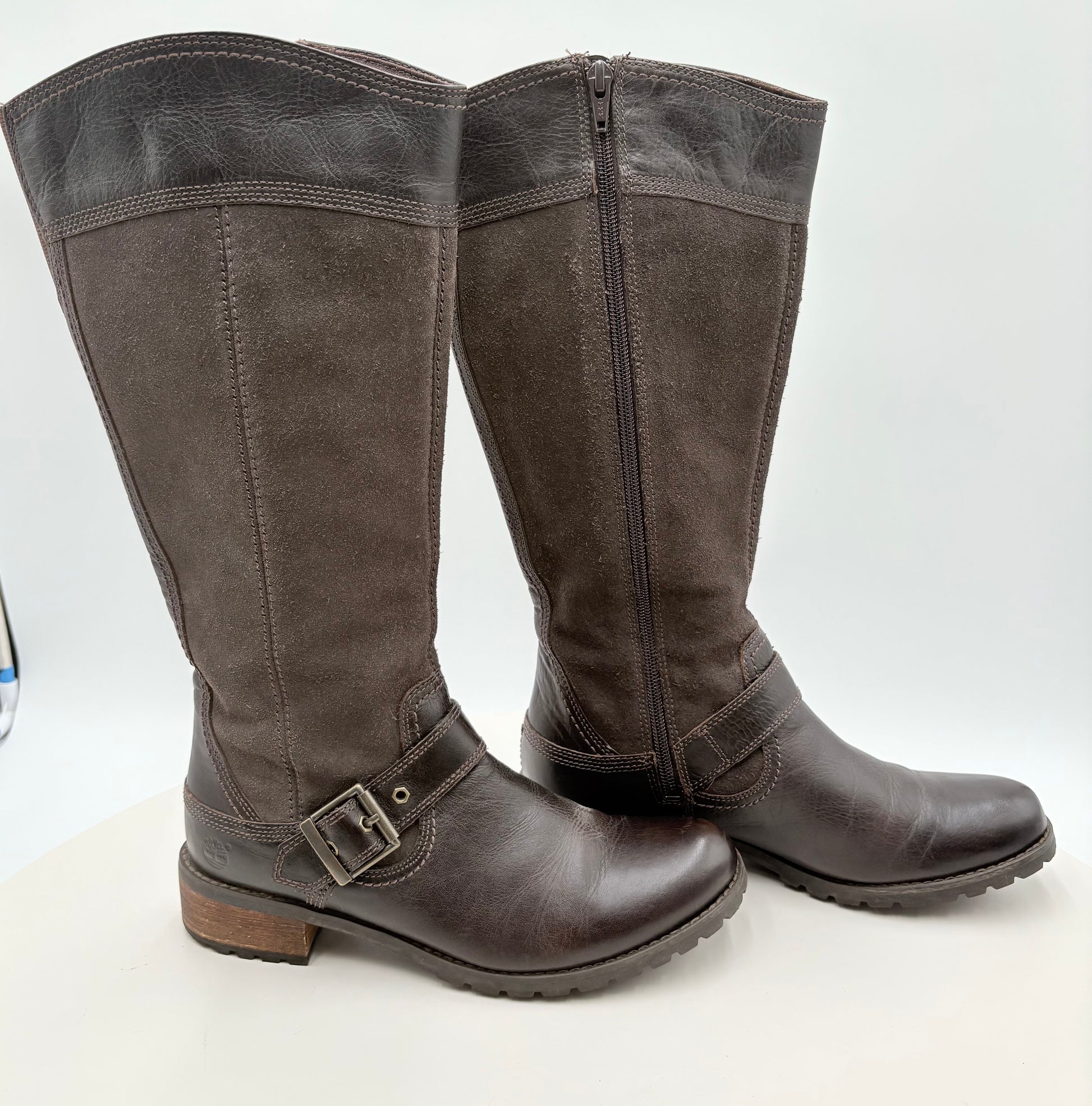 Pair of brown knee-high boots on a white background