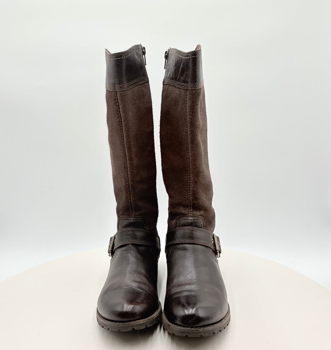 Pair of brown knee-high boots on a white background