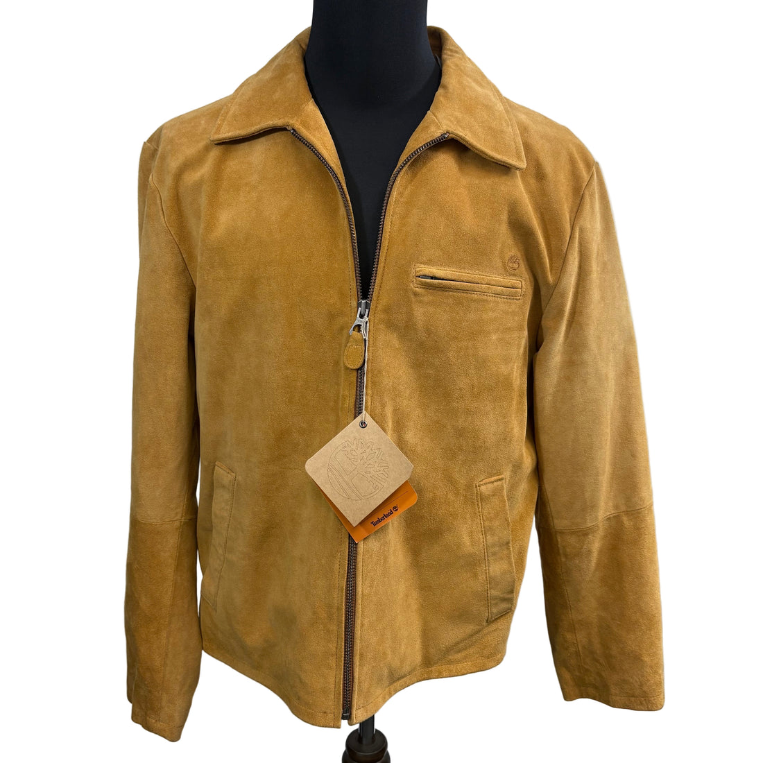 Brown suede jacket on a mannequin against a white background