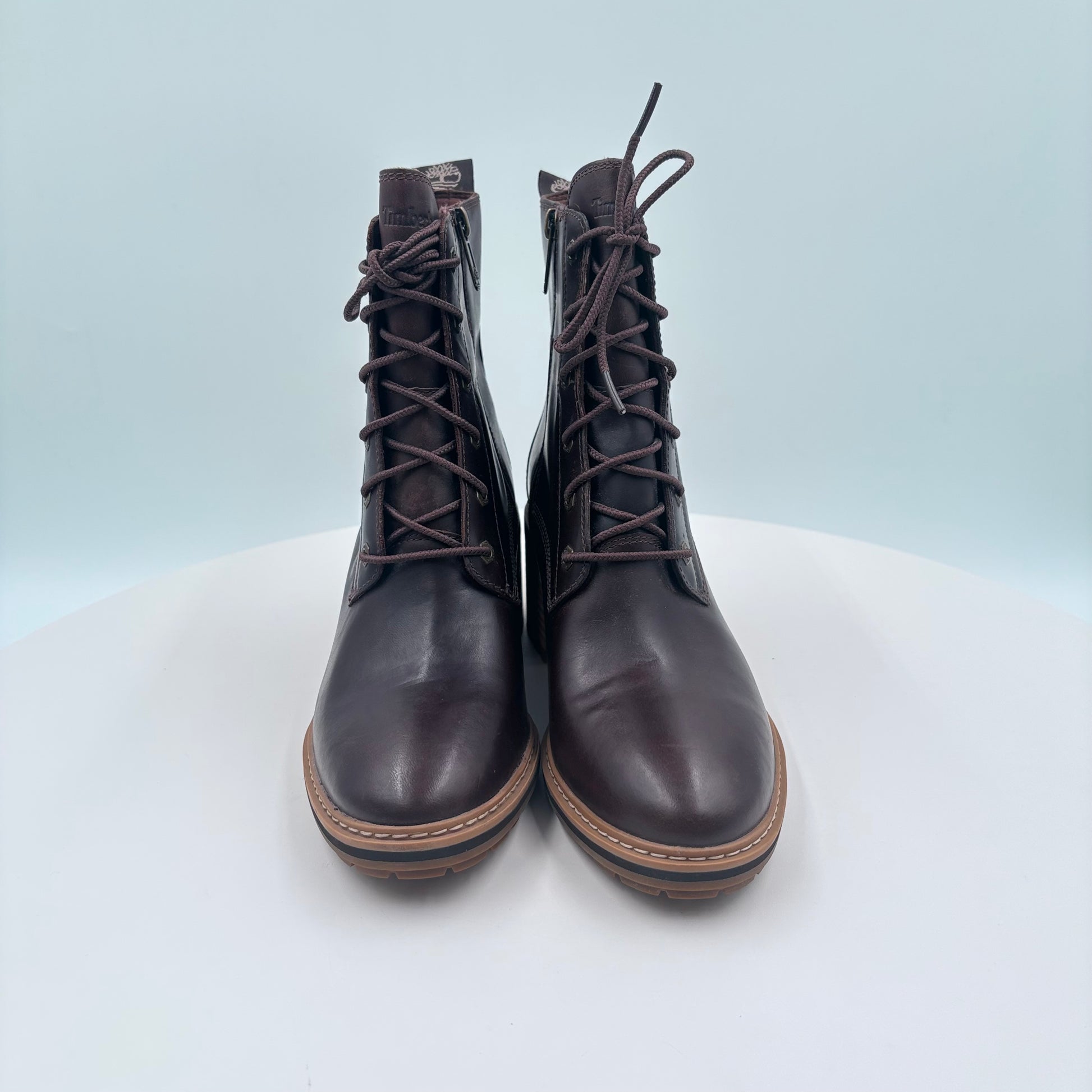 Pair of brown leather boots on a white background