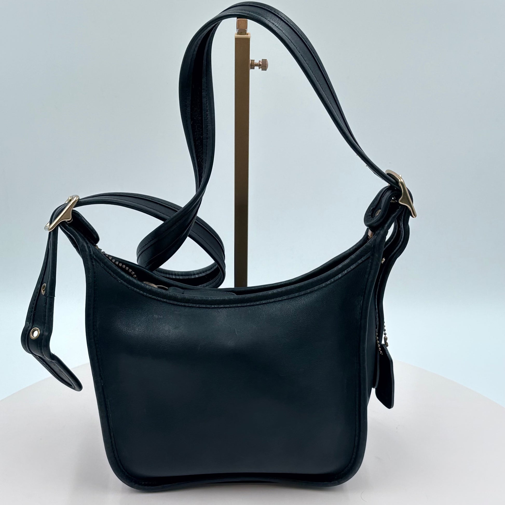 Black leather handbag on a white background