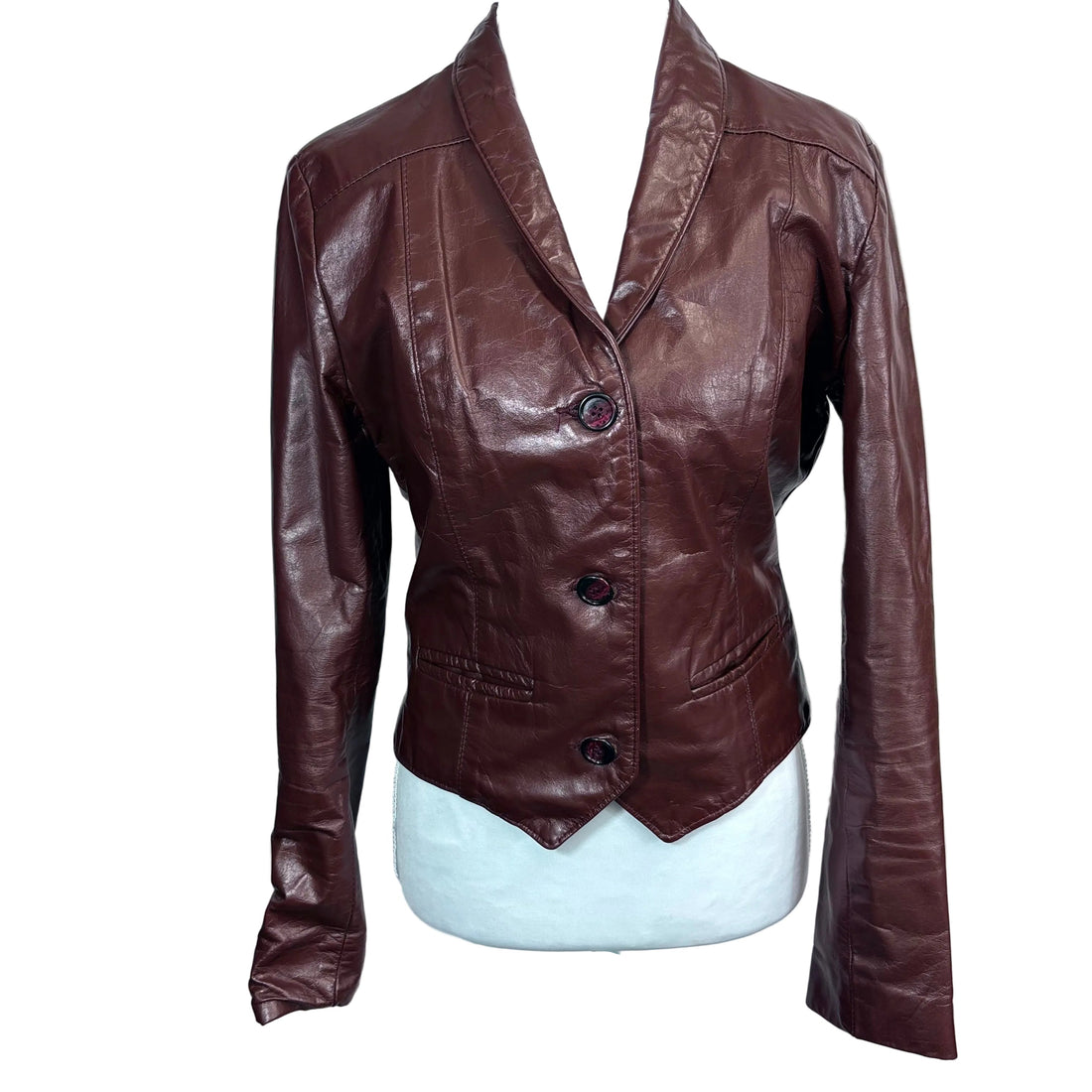 Brown leather jacket on a mannequin against a white background