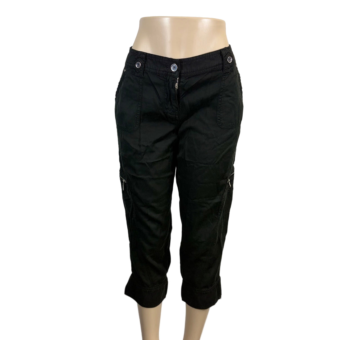 Black pants on a mannequin against a plain background