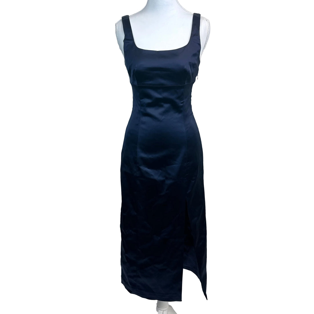 Black dress on a mannequin against a white background
