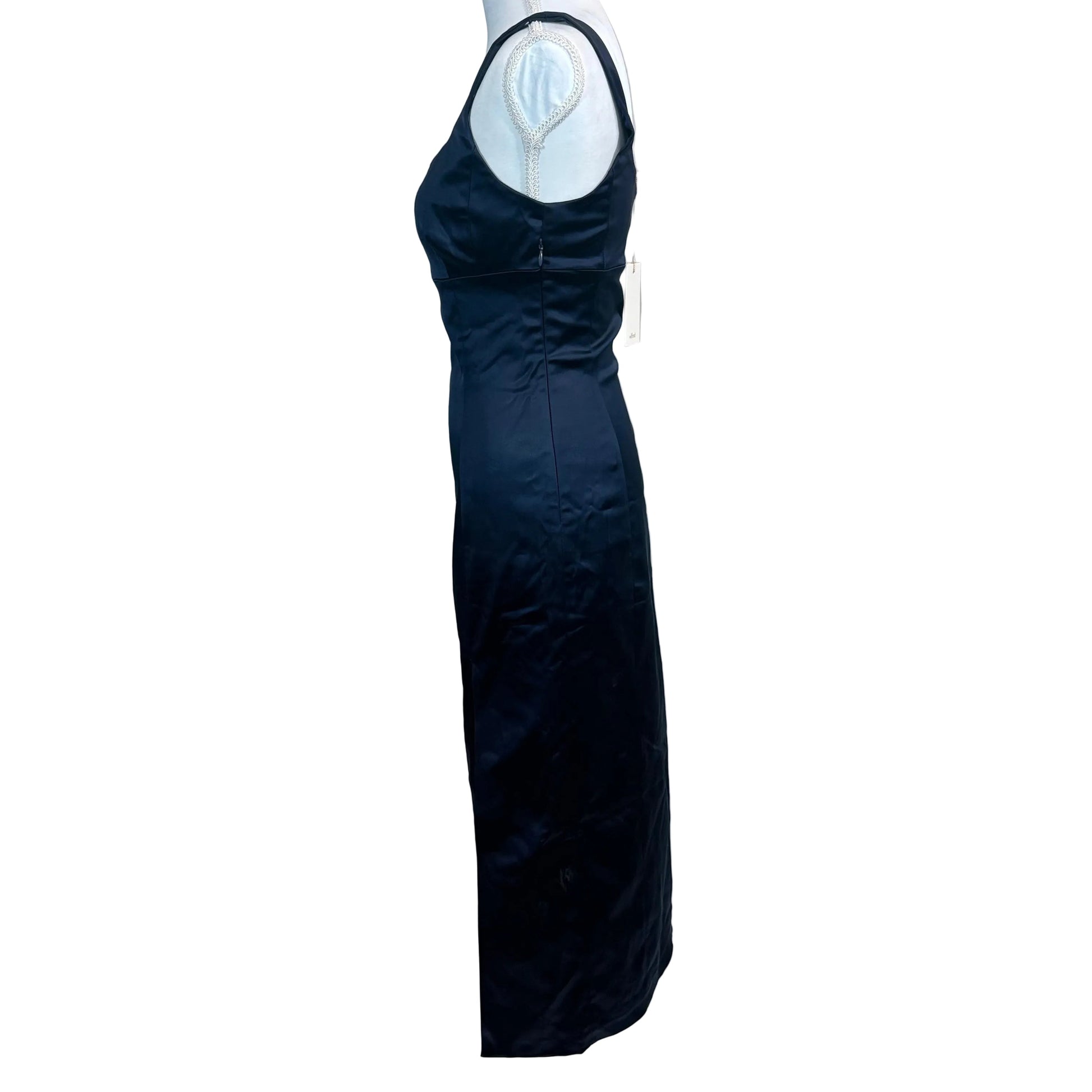 Navy blue evening gown on a mannequin against a white backdrop