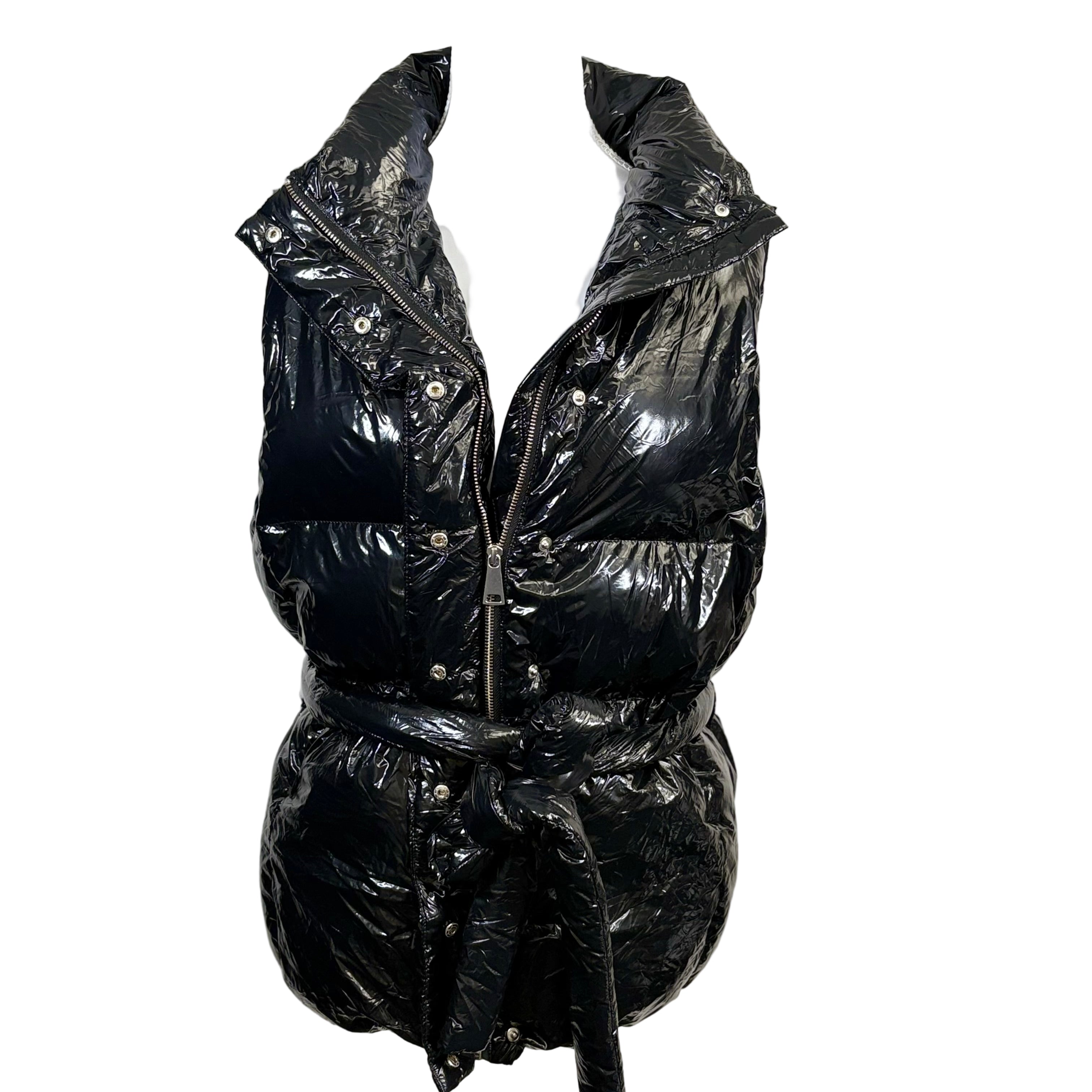 Black puffer vest on a mannequin against a white background