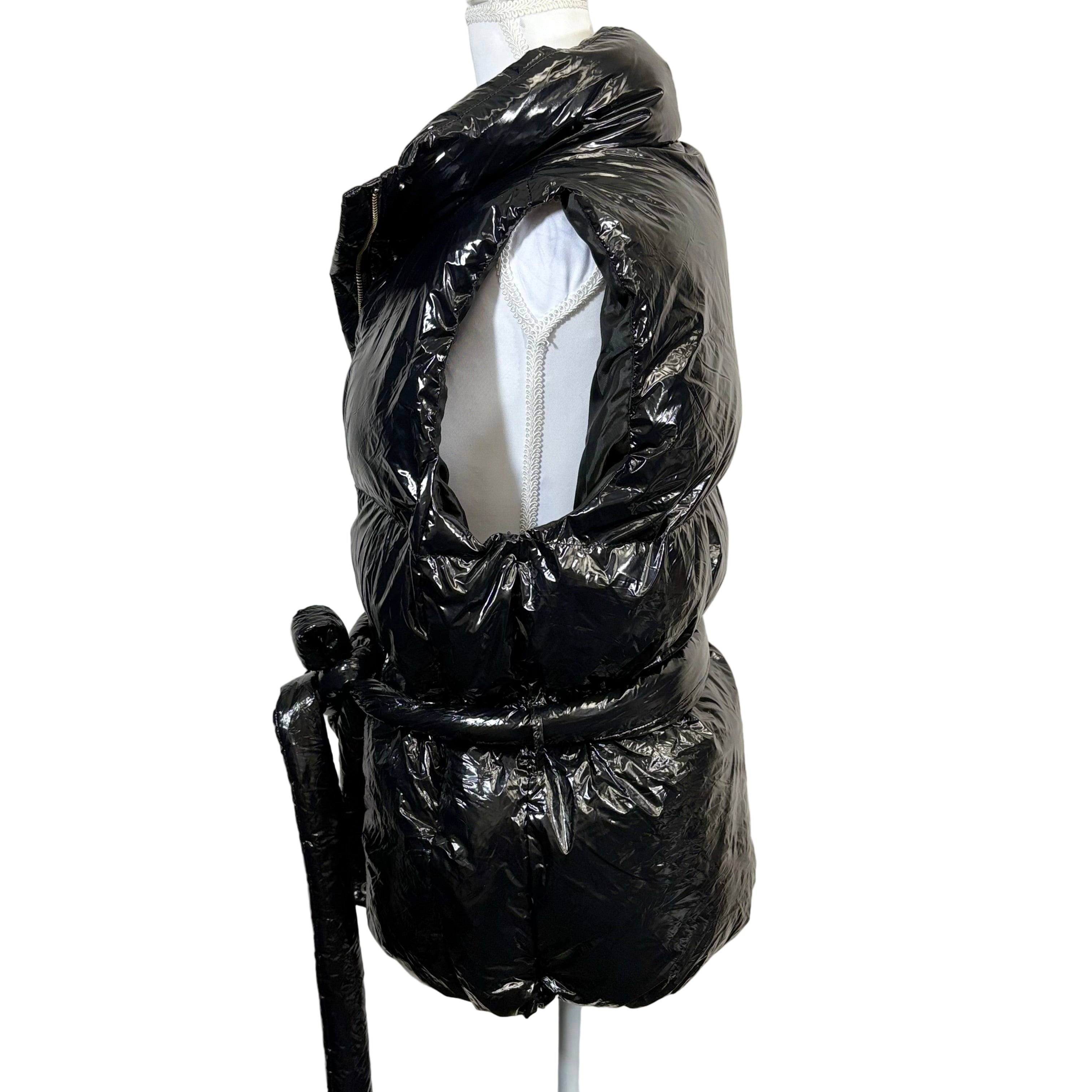 Black quilted jacket on a mannequin against a white background