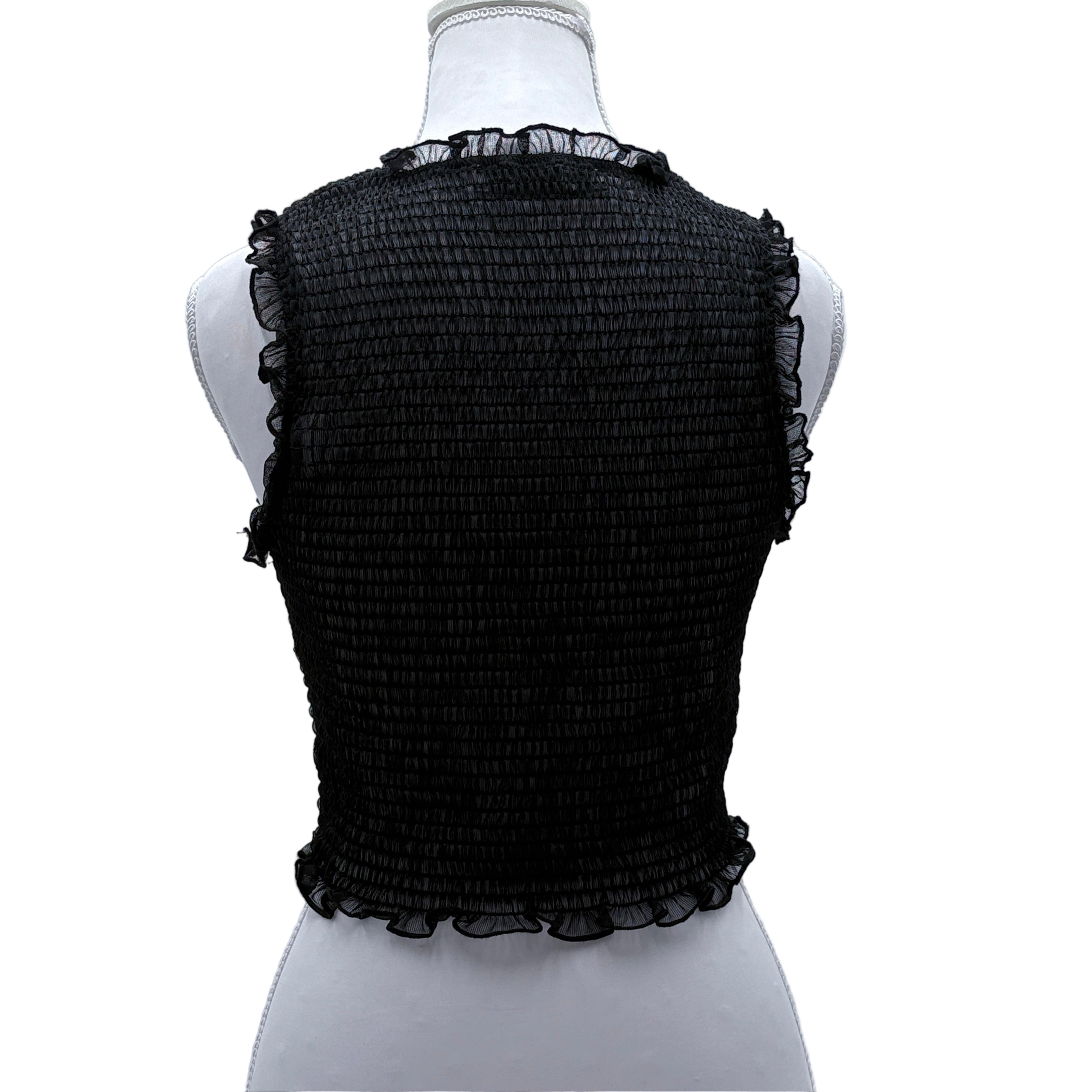 Black textured sheer sleeveless top on a mannequin against a light gray background