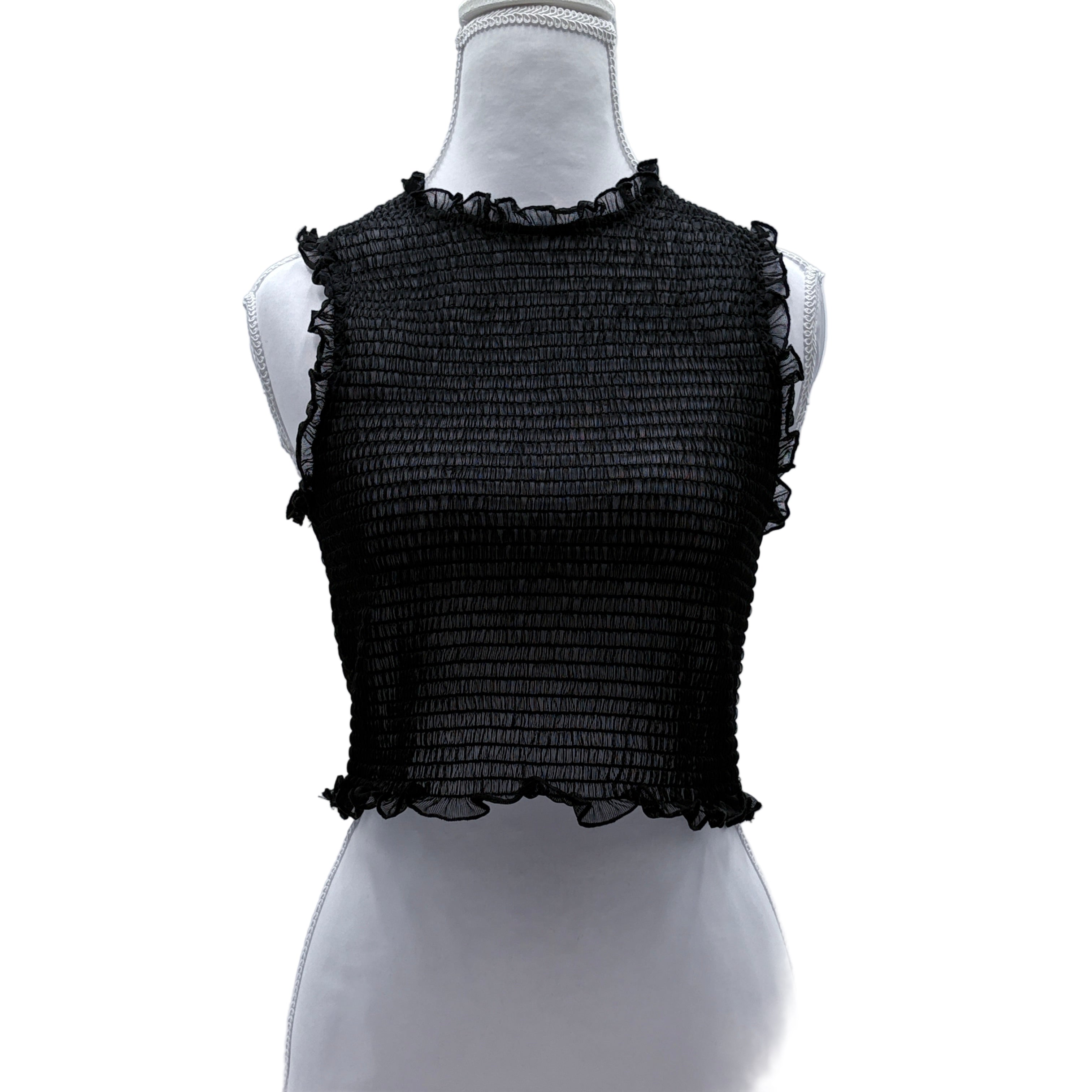 Black textured sleeveless sheer top on a mannequin against a gray background